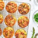 Spring Vegetable Mini Crustless Quiches cooling on a wire rack.