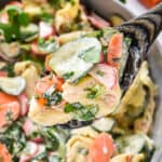 a serving scoop of banh mi inspired tortellini salad with fresh cilantro.