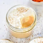 pumpkin spice whipped greek yogurt in a small glass mason jar.